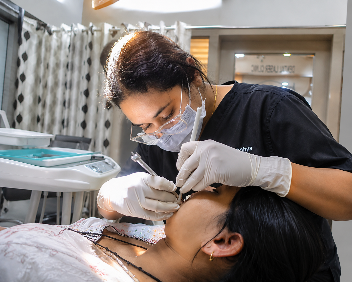 Dr. Akankshya, Lead Dentist, examining a relaxed patient